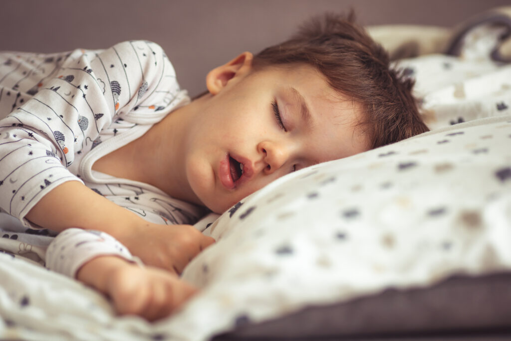 The cause of snoring in toddlers is disrupted airflow from the nose, and mouth to the lungs or something blocking the flow when moving, the toddler will snore.